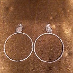 Faux diamond earrings. Never worn. In silver.